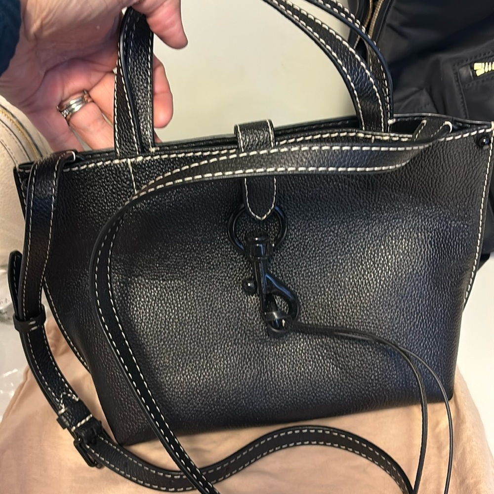 Black Rebecca minkoff. Never carried tag is with it but not attached!